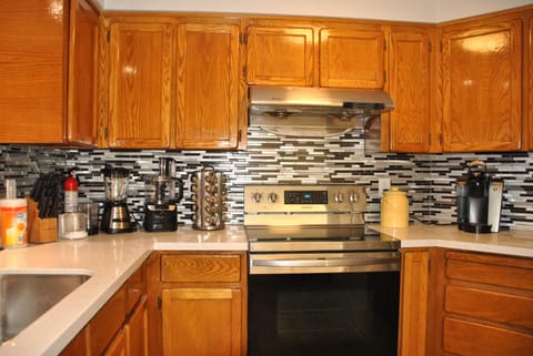 Kitchen w food processors, blender, lots of spices, krups coffee maker, &toaster