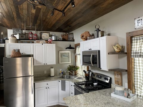 Full size refrigerator, stove and microwave.