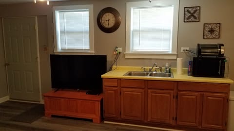 Kitchen counter area and large screen tv