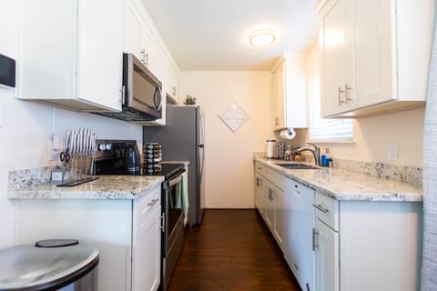 Fully equipped kitchen with stove, oven, microwave, refrigerator and dishwasher.