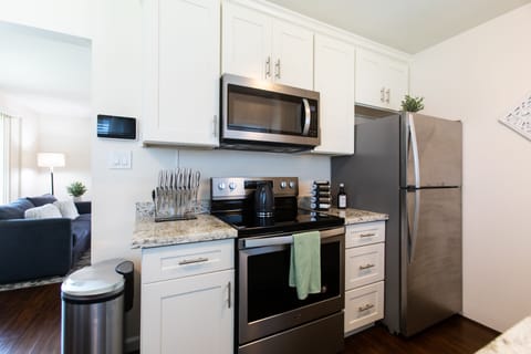 Stove, refrigerator and microwave.