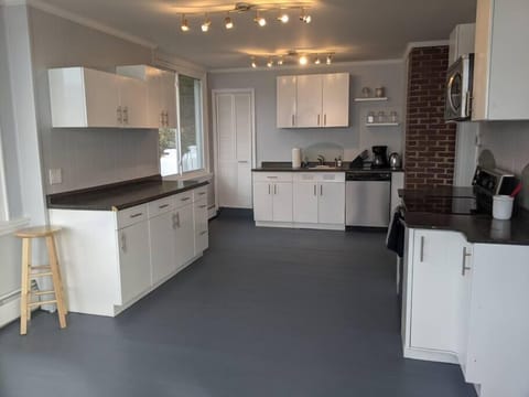 Fully equipped, bright kitchen with stunning lake views