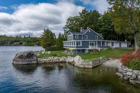 Waterfront lawn, private beach entry, and deepwater dock