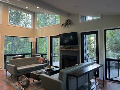 Amazing views of your one acre duneland yard through soaring 15 ft windows