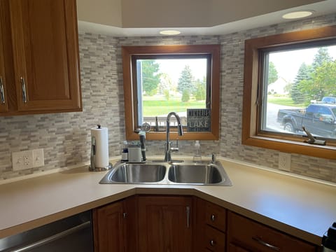 Sink area and countertop with window
