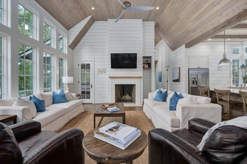 living area | custom kitchen |  lake view | TV | open floor plan | main level 