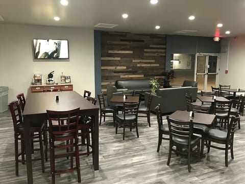 Gather for relaxed conversation in this modern, comfy lounge.