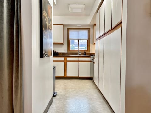 Entry to kitchen with large pantry’s on the right.