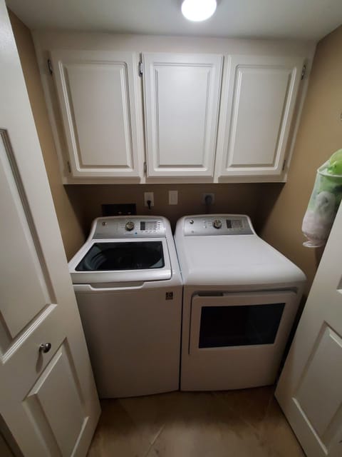 Laundry w/ large capacity washer and dryer