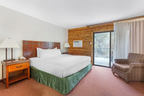 Wake up to fresh air through your private balcony doors.