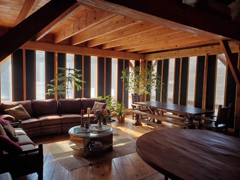 Family room, dining table with seating for 10, plus four bar stools at counter.