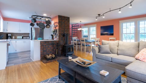 Living room with dining area and kitchen in background