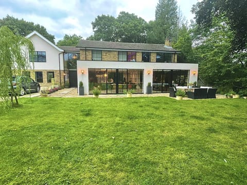 Front view of house. Big sunny garden