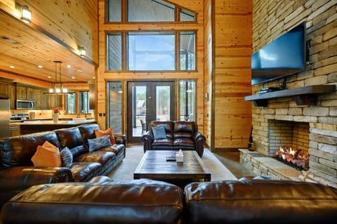 Tall windows surround the living area