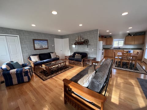 Futon replaced with 2 rocker recliners and 2 twin cots in closet for sleeping