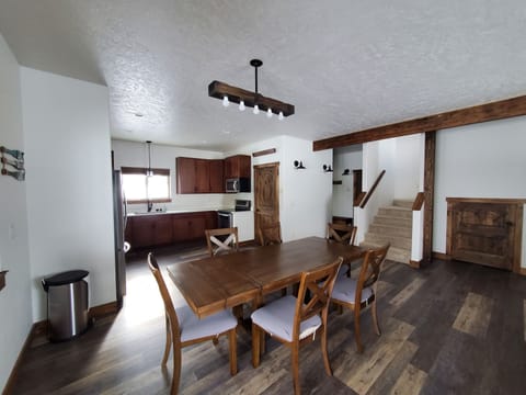 Dining, kitchen, stairs.