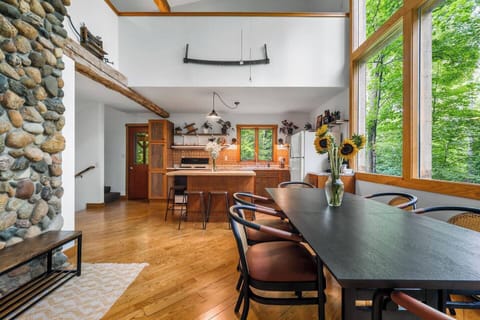 Open concept living allows for folks to mingle between kitchen, dining, and living spaces.