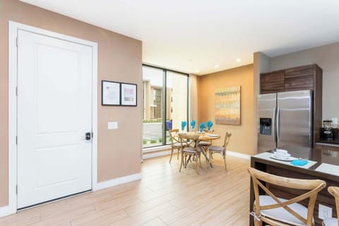 Bright breakfast nook by the large window, seating 4-perfect for morning coffee and planning the day in a warm, modern setting.