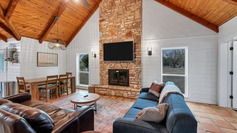 Great room with original stone fireplace.