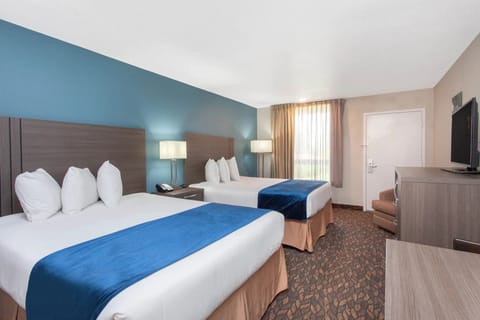 Unwind in crisp, cozy beds after a busy day.
