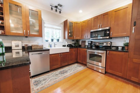Prepare local finds among stainless appliances and warm wood cabinetry.