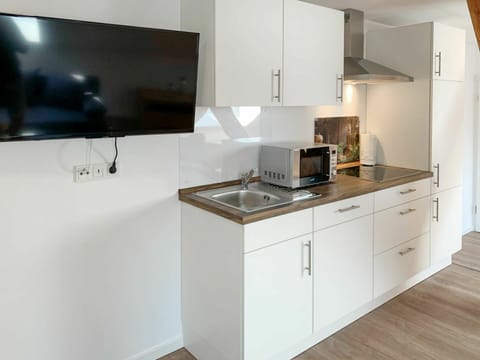 Cabinetry, Countertop, Furniture, Building, Kitchen Stove, Kitchen Appliance, Kitchen, Home Appliance, Wood, Stove