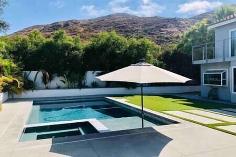 Soak in the view of Cowles Mountain while staying cool in the salt-water pool.