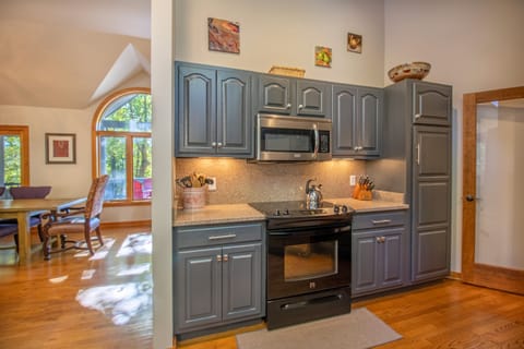 Full kitchen includes oven, stove top, microwave, refrigerator, dishwasher, and more!
