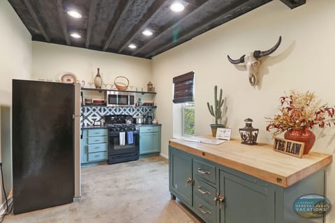 Full kitchen with butcher block workspace