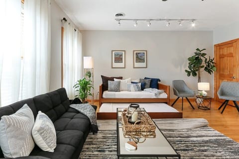 Living room with futon and two twin trundle beds