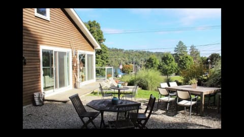 side patio with view of lake with access from living room and master bedroom 