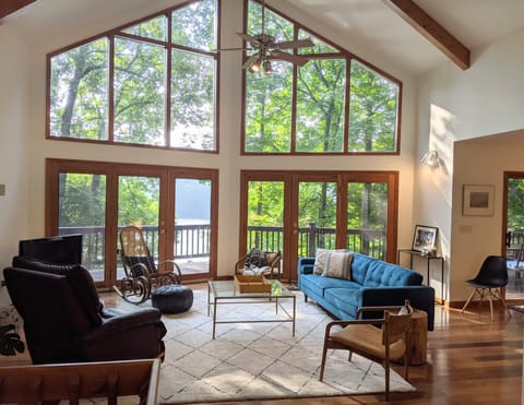 Bright spacious living room features spectacular view, comfy furniture, smart TV