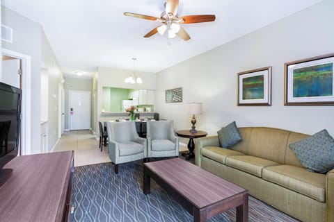 Gather for sunset drinks in the airy lounge by balcony doors.