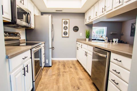 Fully equipped kitchen and large bar area with 3 barstools!  Time to Eat!