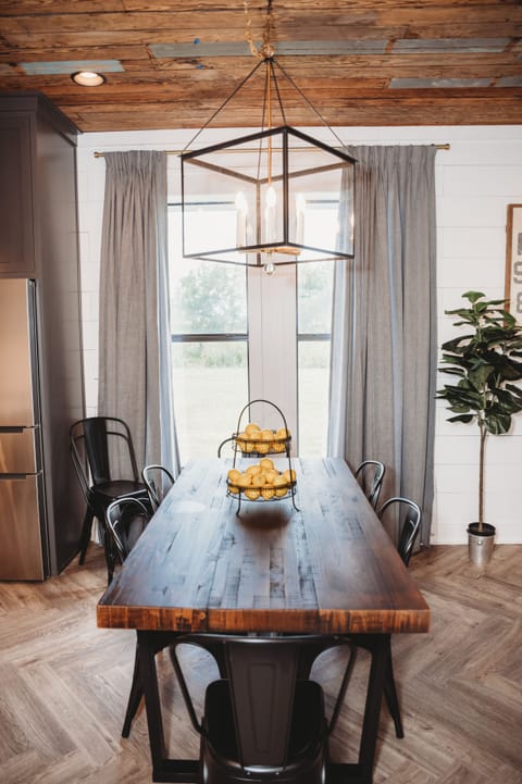 Large dining table with seats for 7 people.