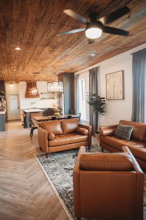 Relax on the leather sofa set in the living room.