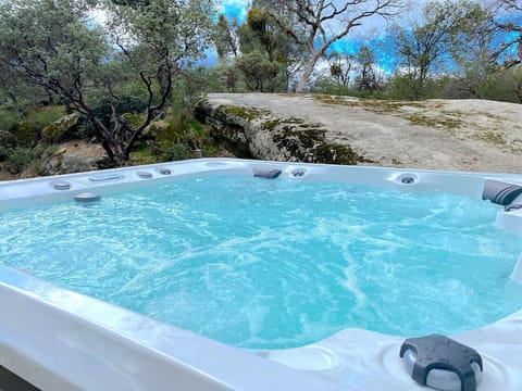 Large seven (7) seat luxury spa overlooking the granite rock with sunset view.