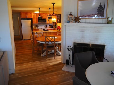 LIVING ROOM:  The home has a very comfy living room with all new furniture, a ceiling fan, great views of Crystal Lake, a game table, and a wood-burning fireplace!