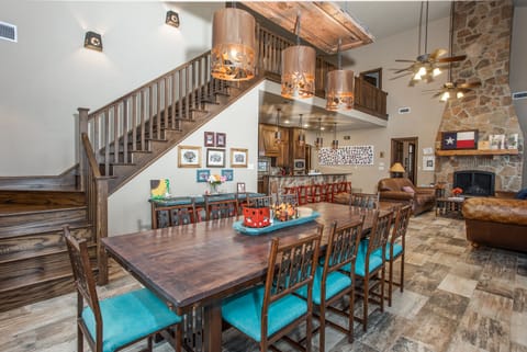 Large dining area leading into living area and kitchen. Dining table can seat 14