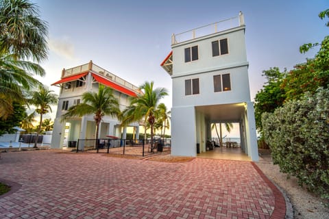 Two homes tucked away just steps from the ocean! Heated pool between the homes.