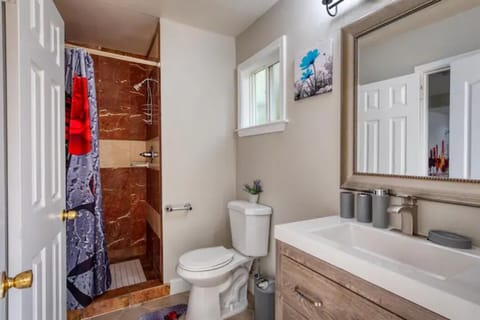 The beauty of natural stone surrounds you as you shower.