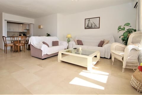 Full view of the lounge area with dining area and kitchen to the rear