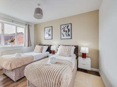 Bedroom 1 has a comfortable zip-link bed set up as two single beds by default or can be zipped together to form a king-size bed upon request. Fresh linen and towels are provided.