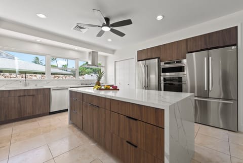 Sleek cabinetry and stainless steel appliances for effortless vacation cooking.