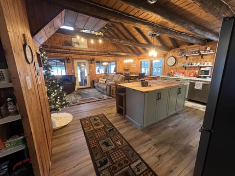 View of kitchen, dining, and main living area from hallway