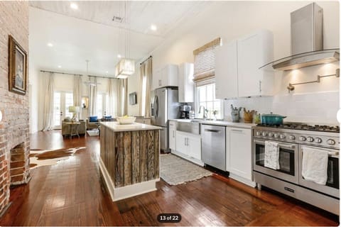 Kitchen with Verona double oven, five burner stove and pull out microwave.