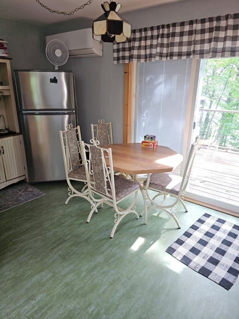 Dining table and patio door out to deck