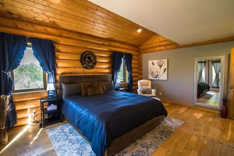 Master bedroom includes a cal king bed, en suite bath with jacuzzi tub and deck