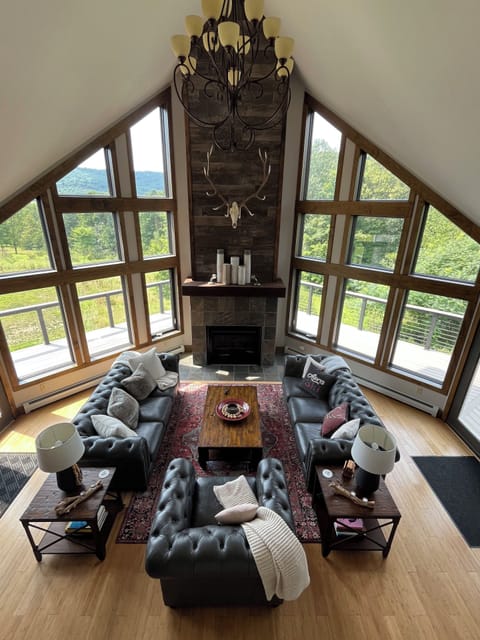 Inspiring great room with ample seating, cozy fireplace and killer views.  