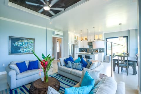 Living room, breakfast bar, and dining table